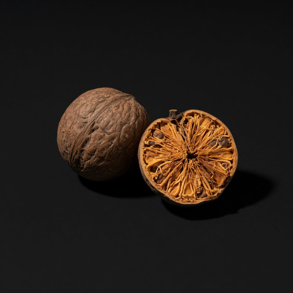 Dried monk fruit halves on a dark surface